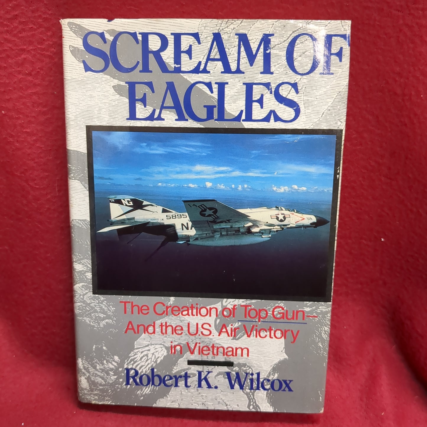 BOOK -  SCREAMS OF EAGLES: THE CREATION OF TOP GUN AND THE U.S. AIR VICTORY IN VIETNAM: WRITTEN BY ROBERT K. WILCOX: 1990  (BOX35)