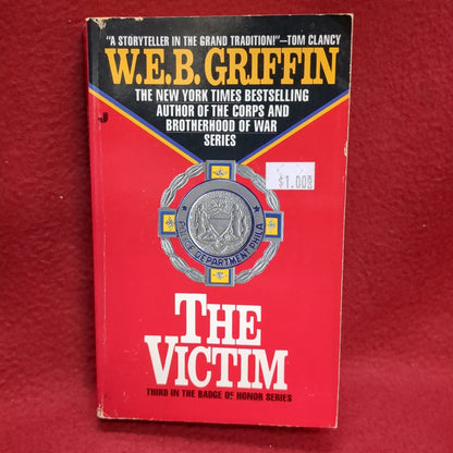 BOOK      THE VICTIM (3RD IN BADGE OF HONOR SERIES)  (BOX46)