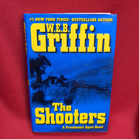 BOOK      THE SHOOTERS (PRES. AGENT NOVEL)   (BOX50)